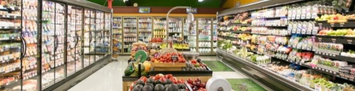 A grocery store aisle with store brand products ranging from fruit, vegetables and dairy.