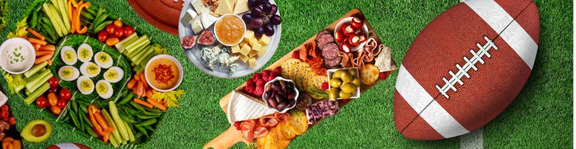 Assorted food and cheese trays on a football field.