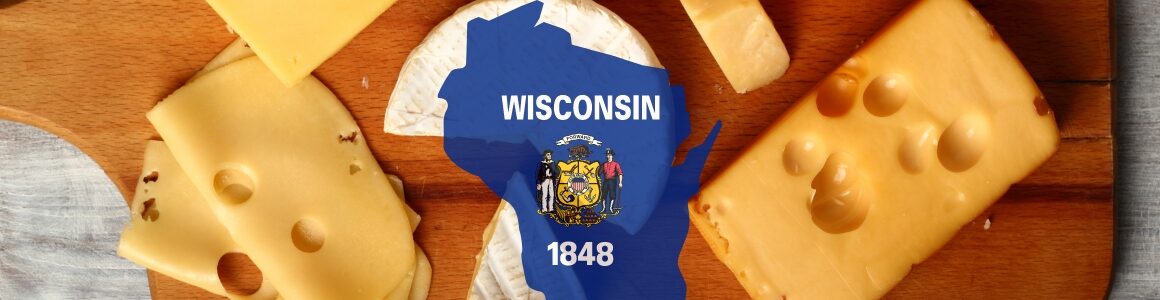 Platter of various cheeses with the outline of the state of Wisconsin.