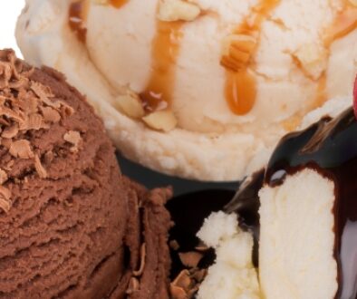 Scoops of chocolate, vanilla, and caramel ice cream.