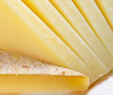 Slices of Gruyere AOP cheese on a platter.