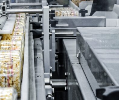 Food on a conveyor belt in a production facility.