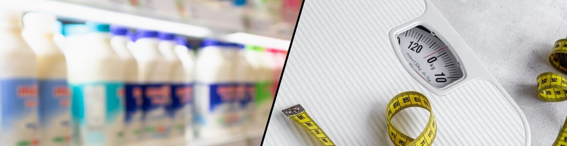 Blurred dairy products on a grocery store shelf beside a weight scale and measuring tape.